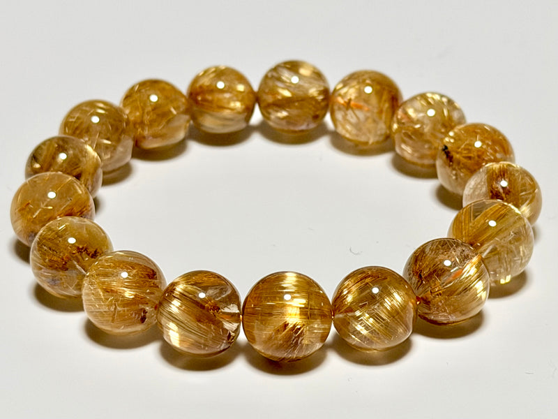Taichin Golden Rutilated Quartz bracelet, 12–12.5 mm, product image showing gold rutile needles and quartz translucency.
