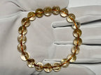 手袋着用で持ったクリアルチルクォーツ9.5mm。金紅石入り水晶の透明感と繊細な金針が映える一本です。